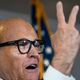 Rudy Giuliani accuses people of voting twice as he speaks to the press about various lawsuits related to the 2020 election, inside the Republican National Committee headquarters on November 19, 2020.